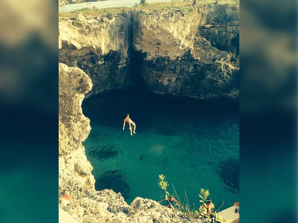 About Page - Cliff jumping in Jamaica